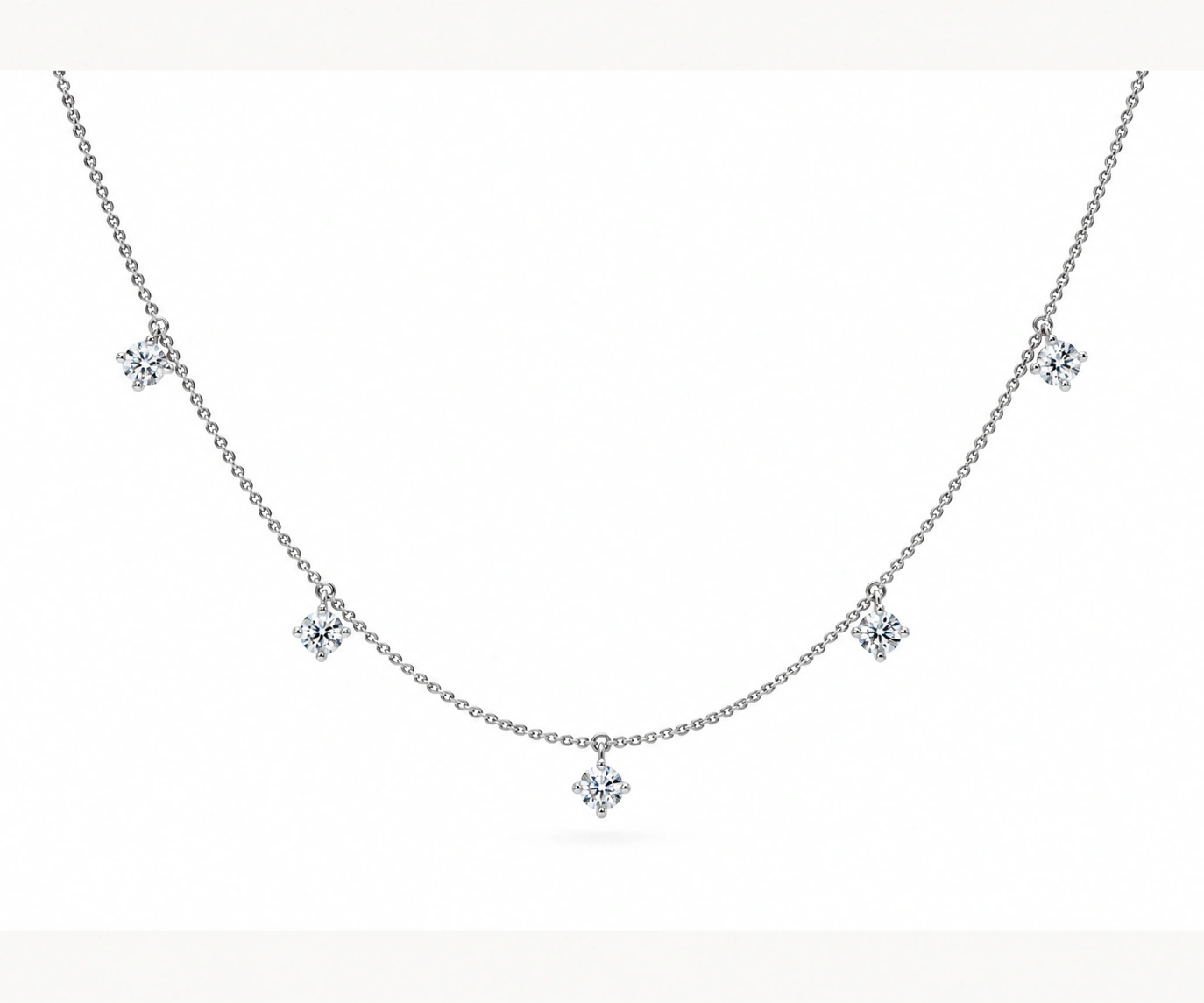 Otún Quimbaya · Collar con cinco diamantes colgantes — Oro blanco 18k
