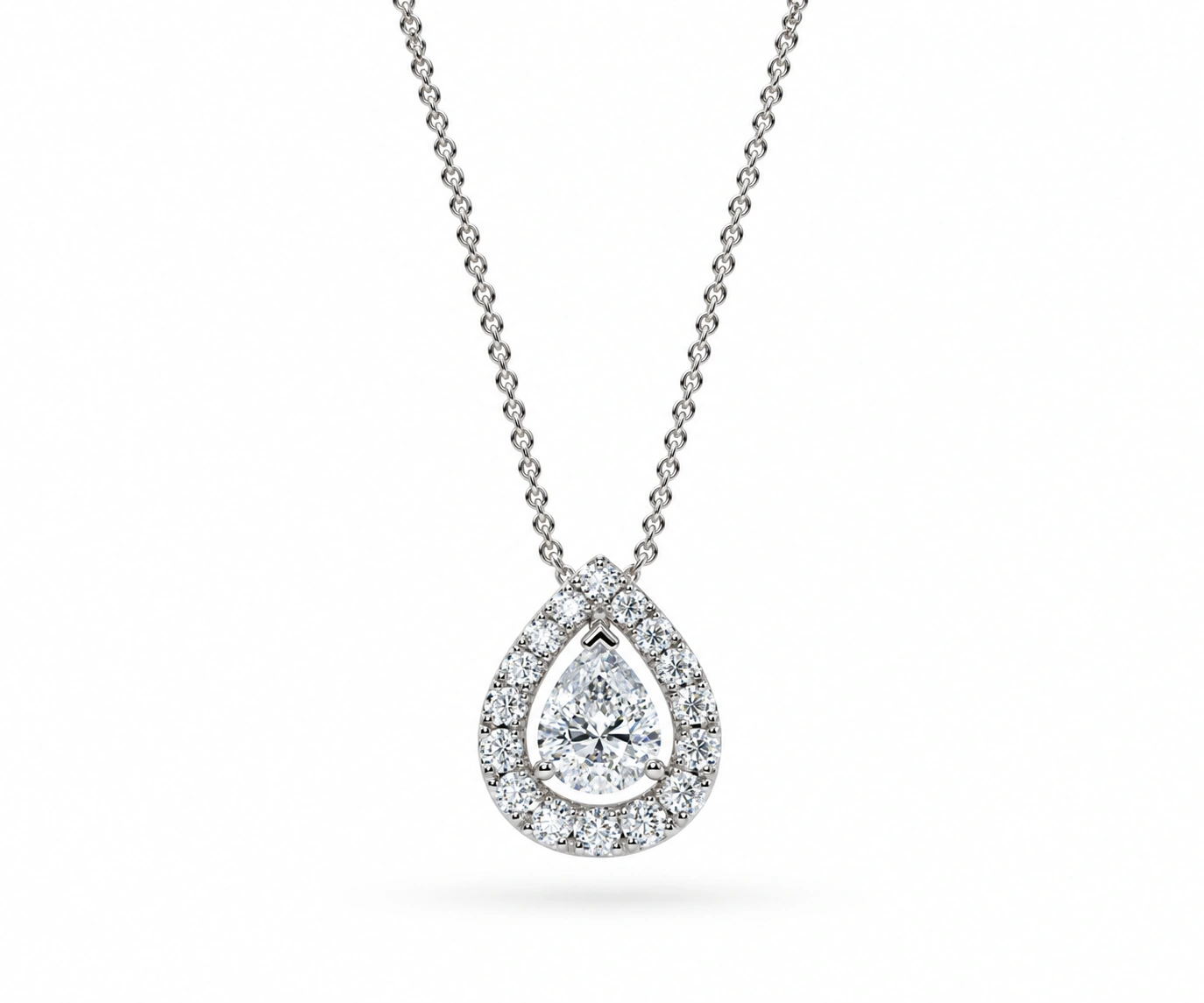 Rosario · Dije con diamante pera y halo de diamantes — Oro blanco 18k