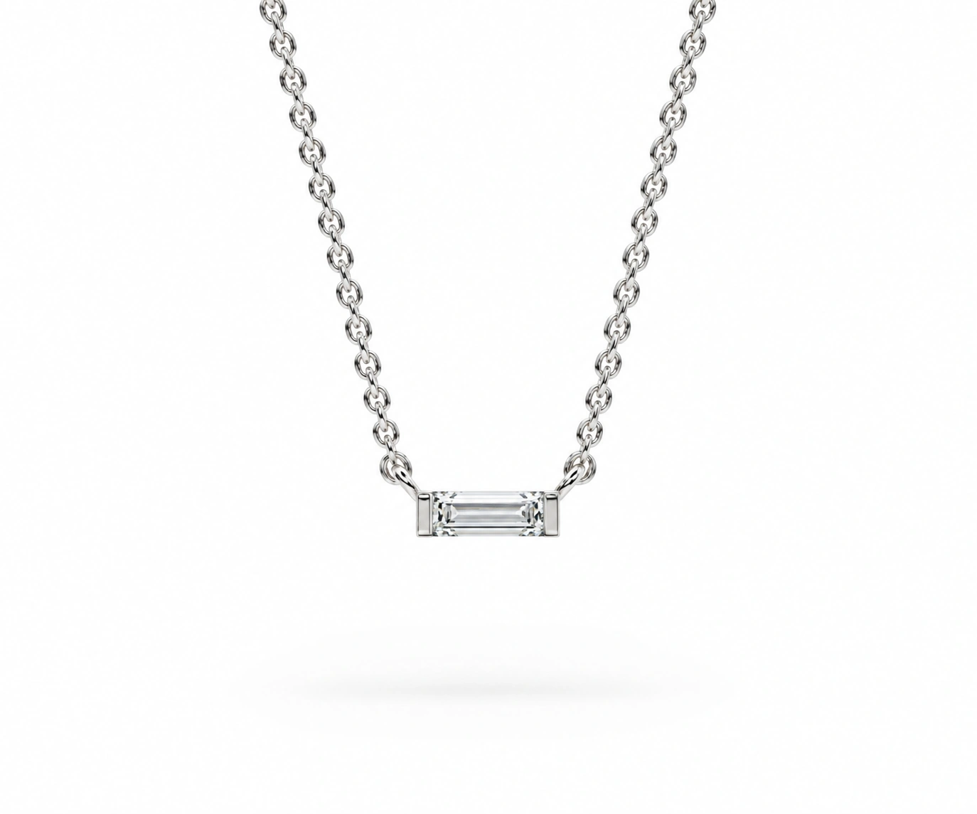 Capurganá · Dije solitario de diamante baguette — Oro blanco 18k