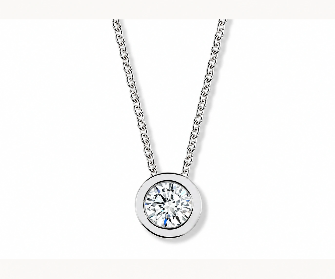Cispatá · Dije con diamante redondo en bisel ancho — Oro blanco 18k