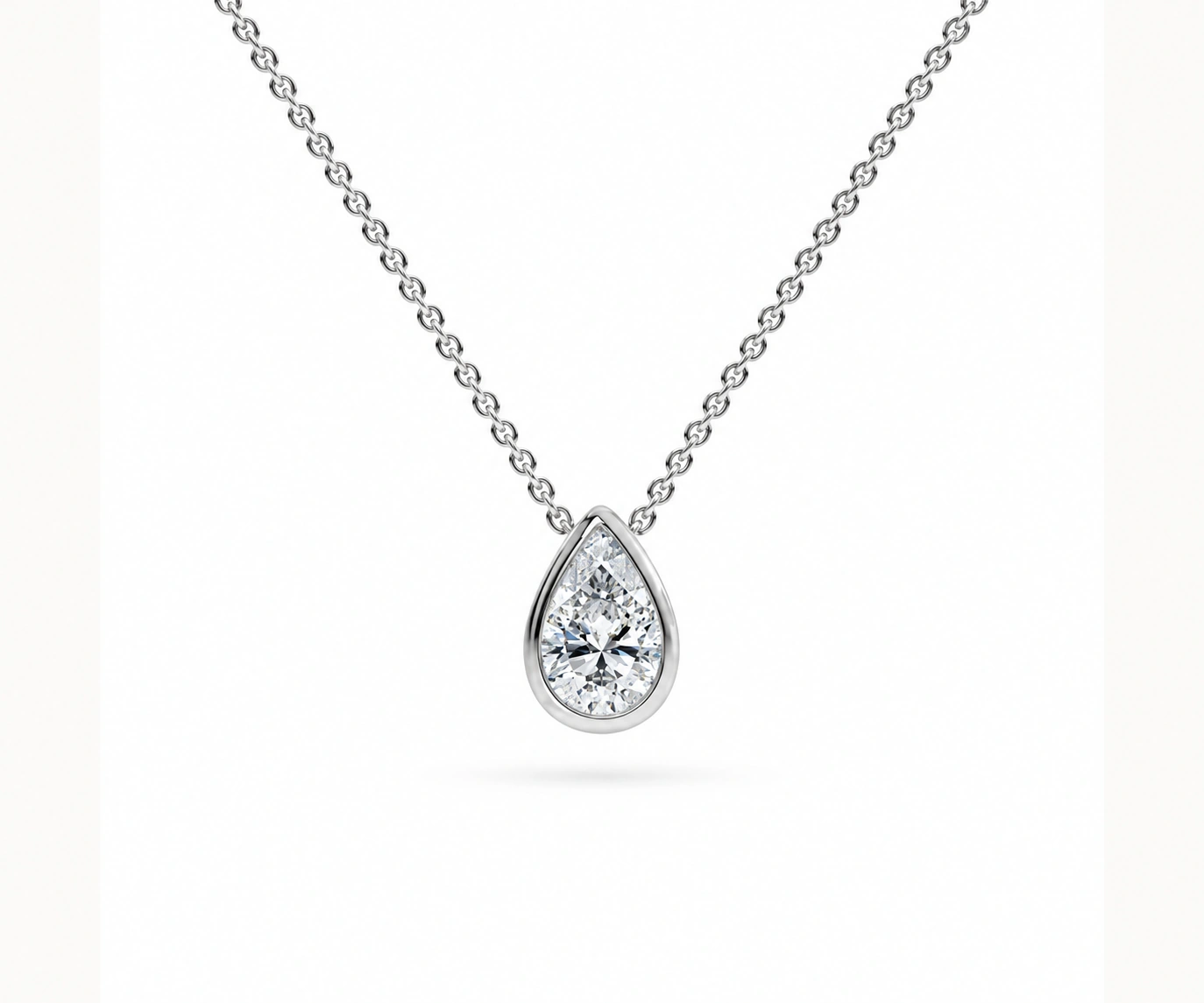 Sumapaz · Dije con diamante pera en bisel — Oro blanco 18k