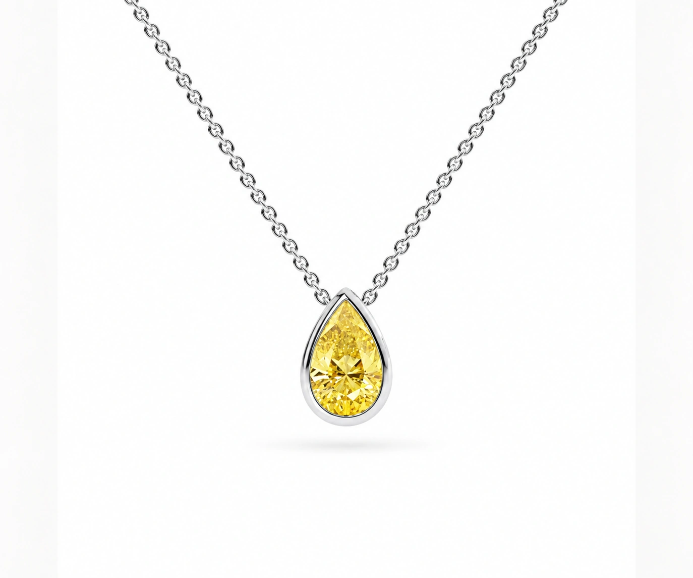 Utría · Dije con diamante amarillo pera en bisel — Oro blanco 18k