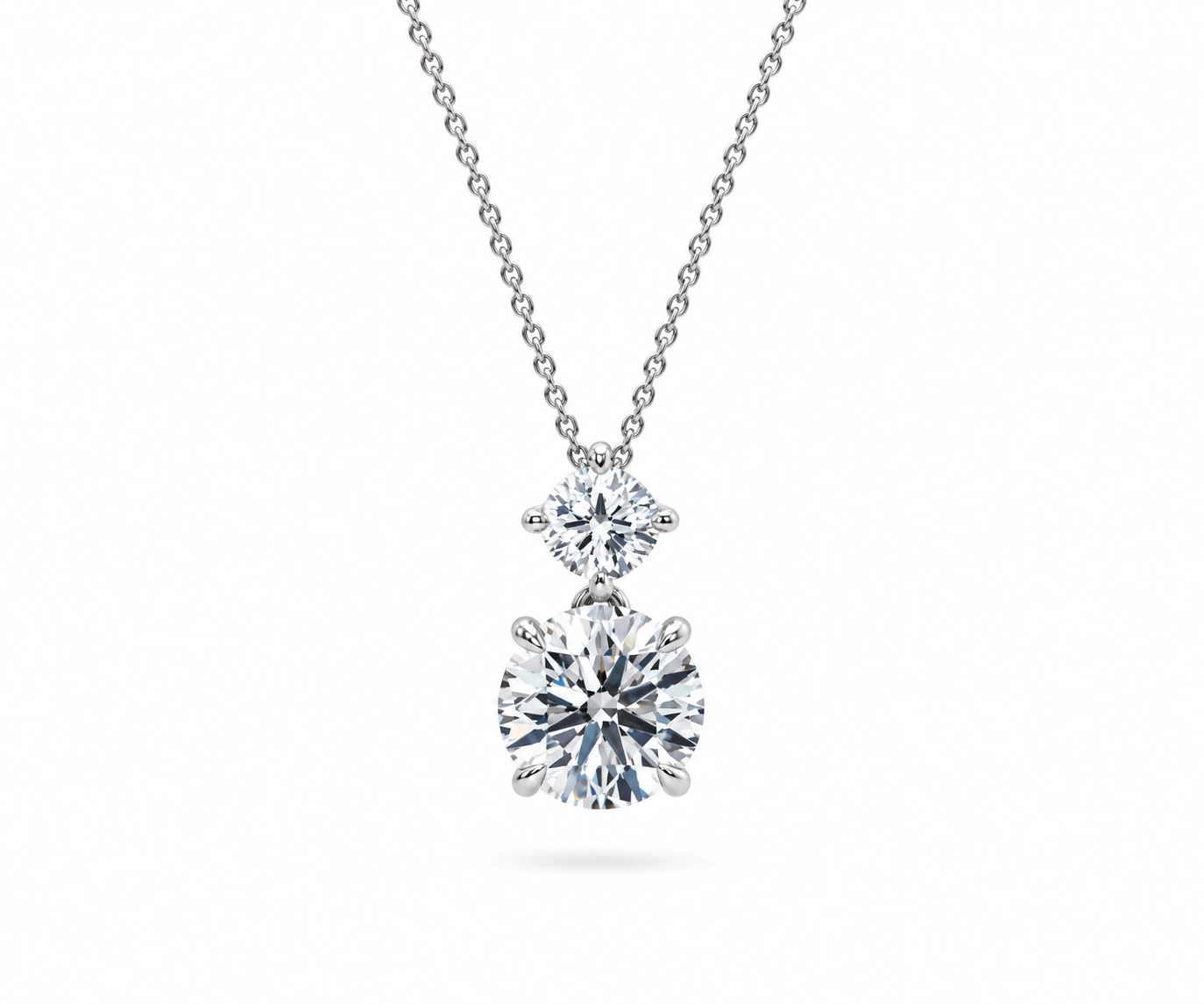 Puracé · Dije con diamante cojín arriba y redondo abajo — Oro blanco 18k